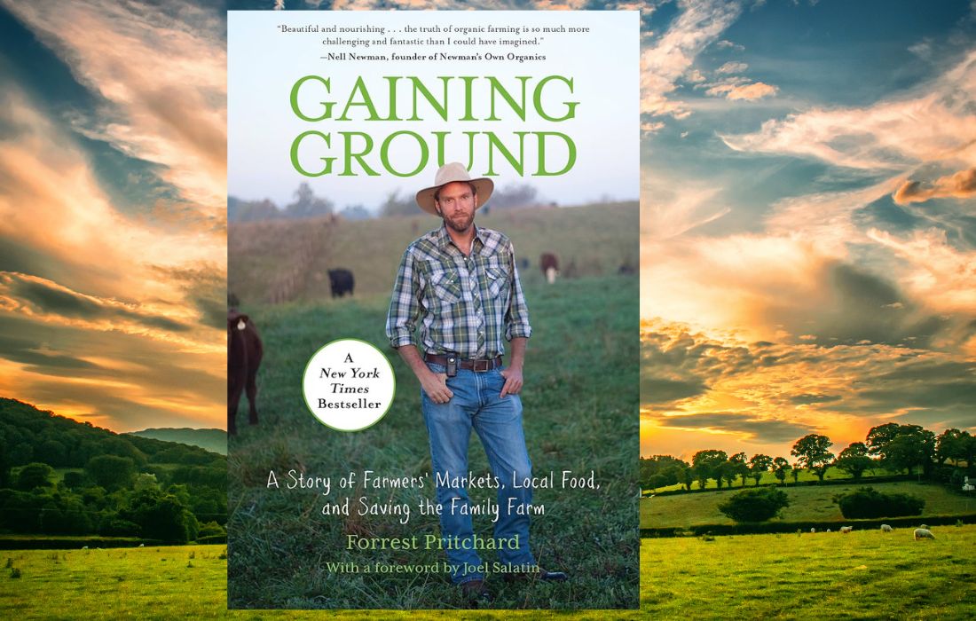 book cover showing author in field with a cow 