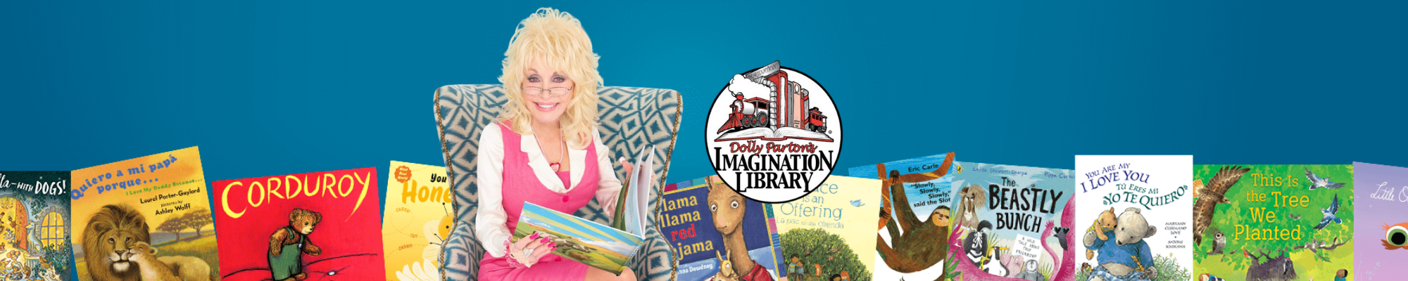 Dolly Parton sitting in a chair with a children's book