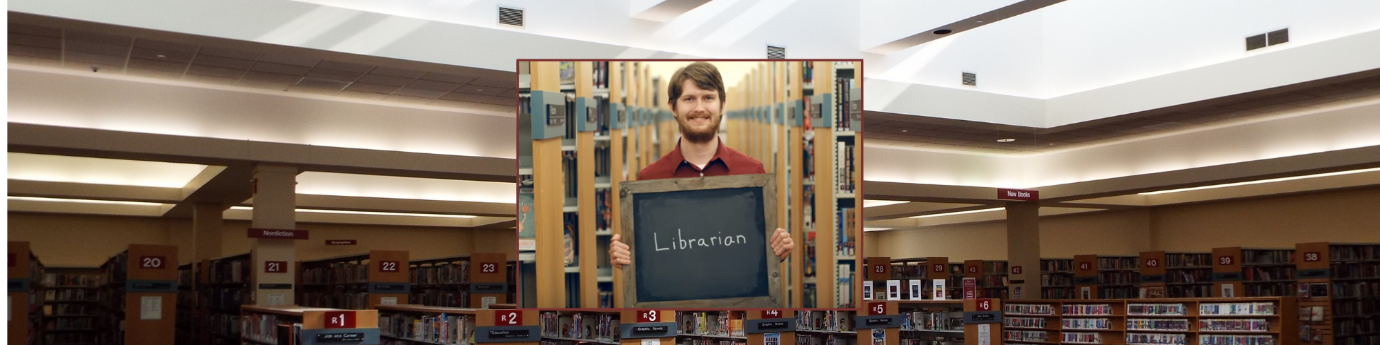 photo of adult services manager holding a sign that says librarian