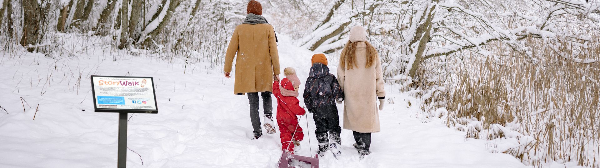 family in park at wintertime